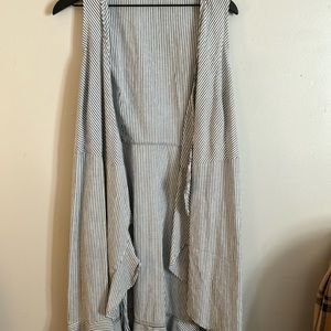 Blue and white striped dress with high low bottom and ruffles.